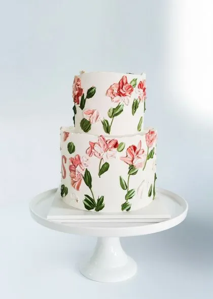 Beautiful custom wedding cake for destination wedding in Phuket with floral arrangements