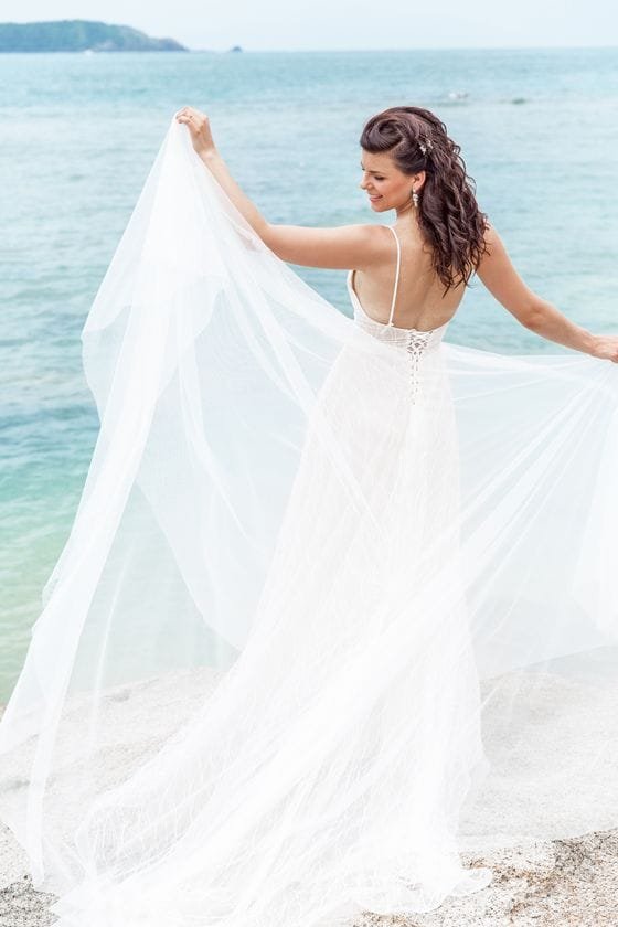 Wedding dress rental Phuket - stunning bride in white dress by the ocean